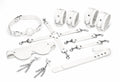 Набір Feral Feelings BDSM Kit 7 White, наручники, поножі, конектор, маска, падл, кляп, затискачі
